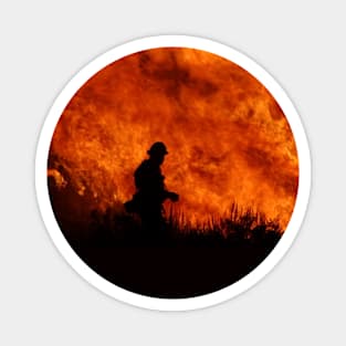 Fireman Silhouette in front of Fire Magnet